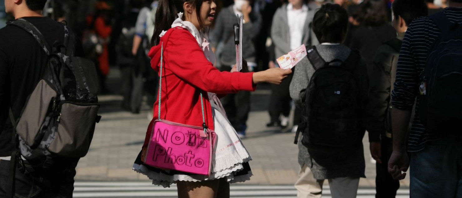 Maid promoting cafe at Chuo Dori, Akihabara, Japan