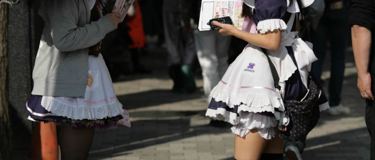 Maids talking at Chuo Dori, Akihabara, Tokyo, Japan